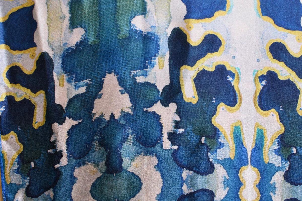 Close-up of a fabric with a blue and green abstract pattern