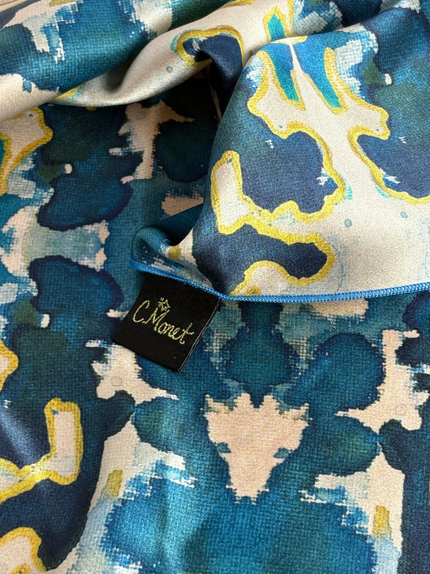 Close-up of a patterned fabric with a visible brand tag.