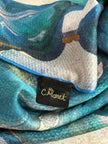 Close-up of a floral-patterned fabric with a brand label 