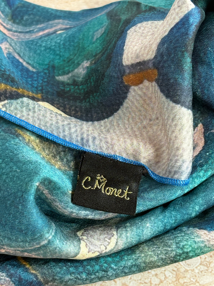Close-up of a floral-patterned fabric with a brand label 
