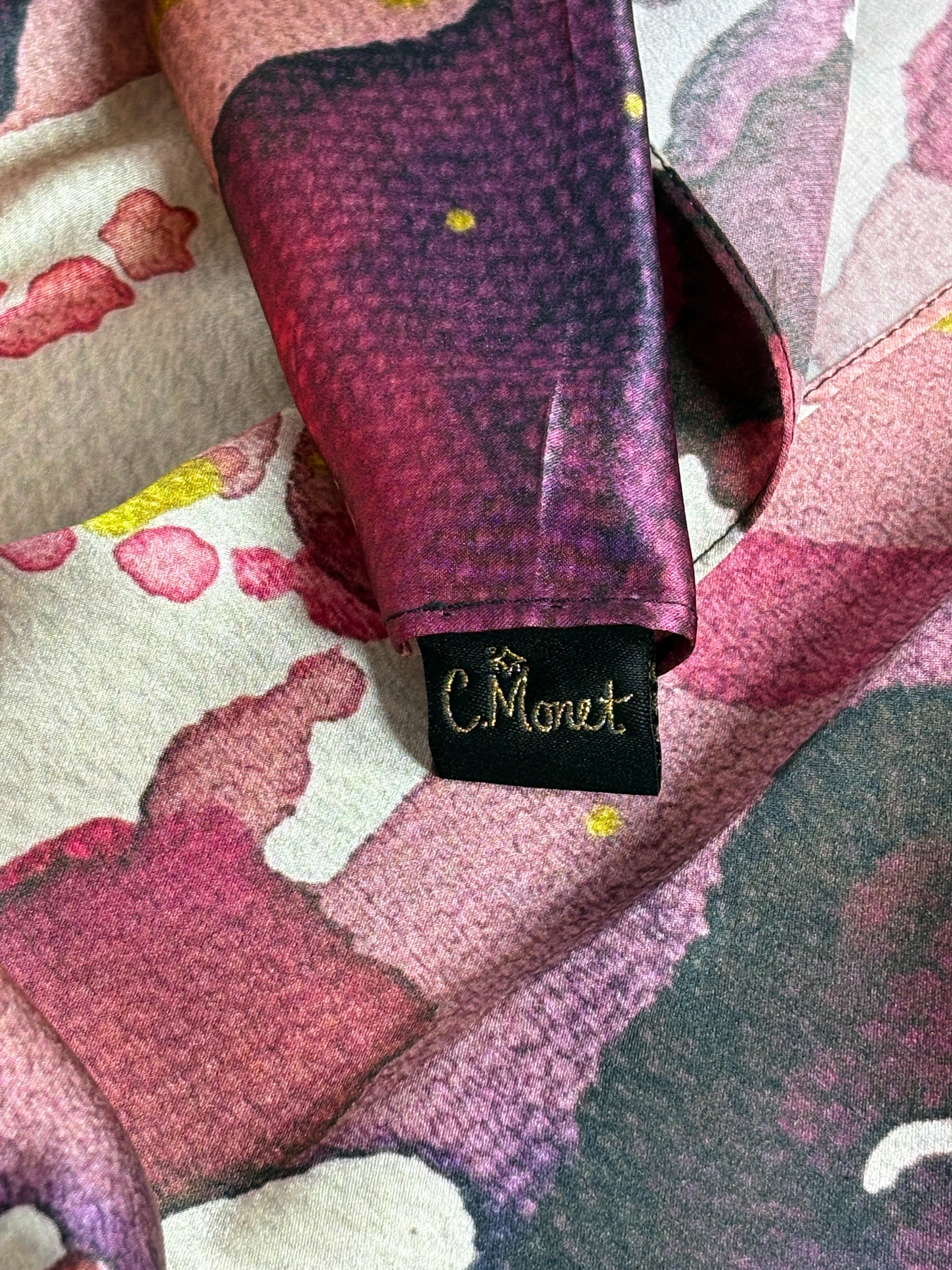 Close-up of a patterned fabric with a visible brand tag.