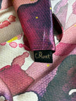 Close-up of a patterned fabric with a visible brand tag.