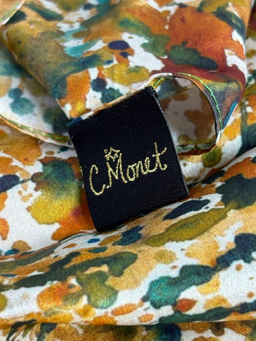 Floral-patterned fabric with a 'C. Monet' label.