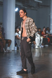 Model walking on a runway during a fashion 