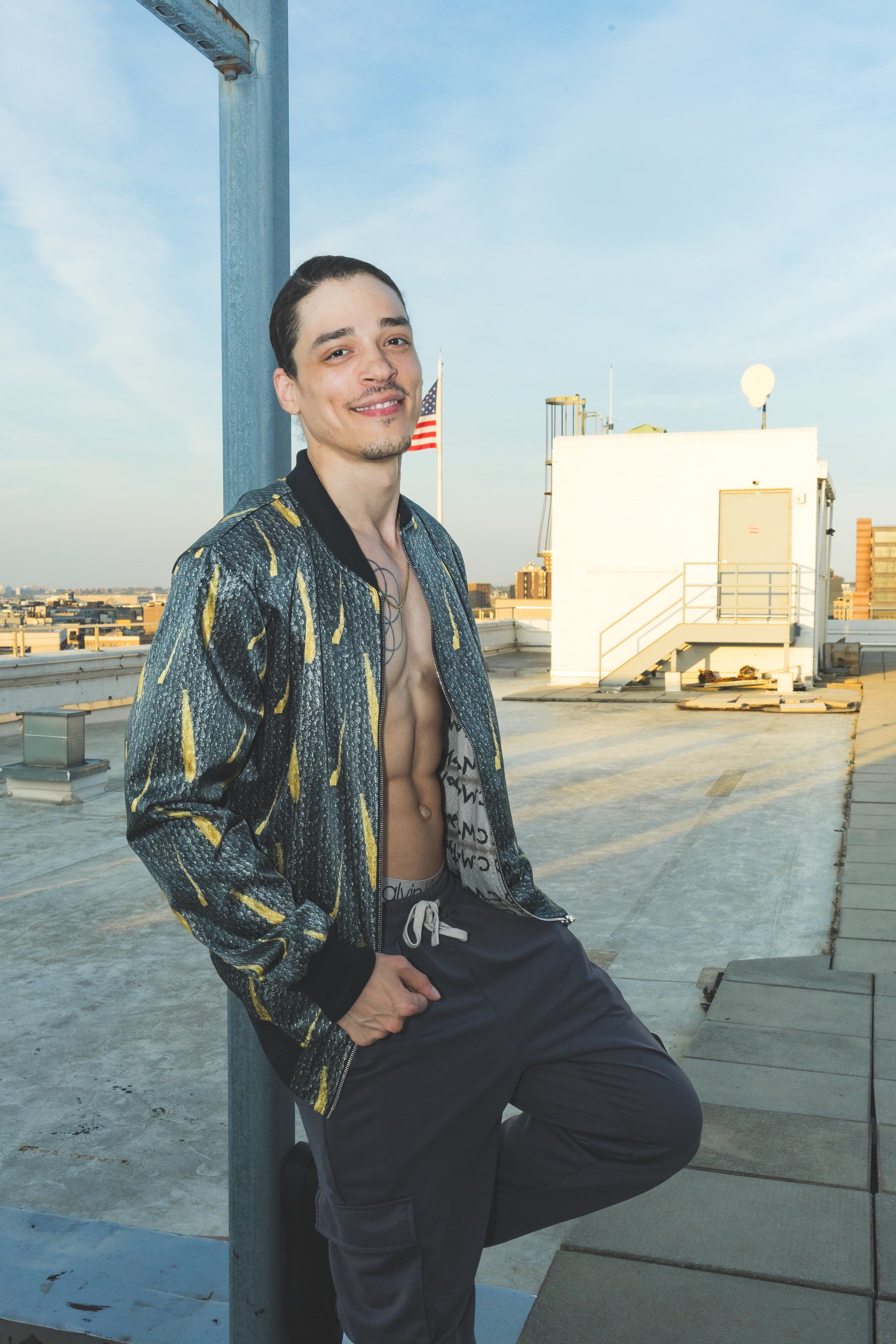 Man posing on a rooftop 
