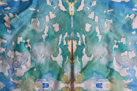 Abstract watercolor pattern with blue, green, and white colors