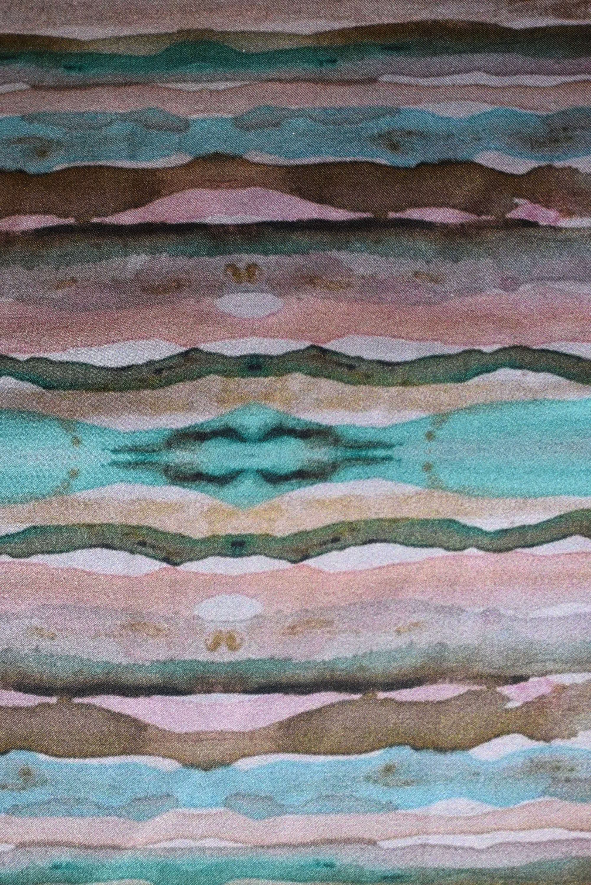 Patterned fabric with wavy lines in green, brown, and pink.