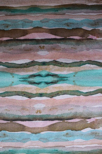 Patterned fabric with wavy lines in green, brown, and pink.