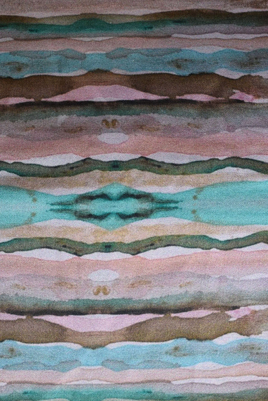 Patterned fabric with wavy lines in green, brown, and pink.