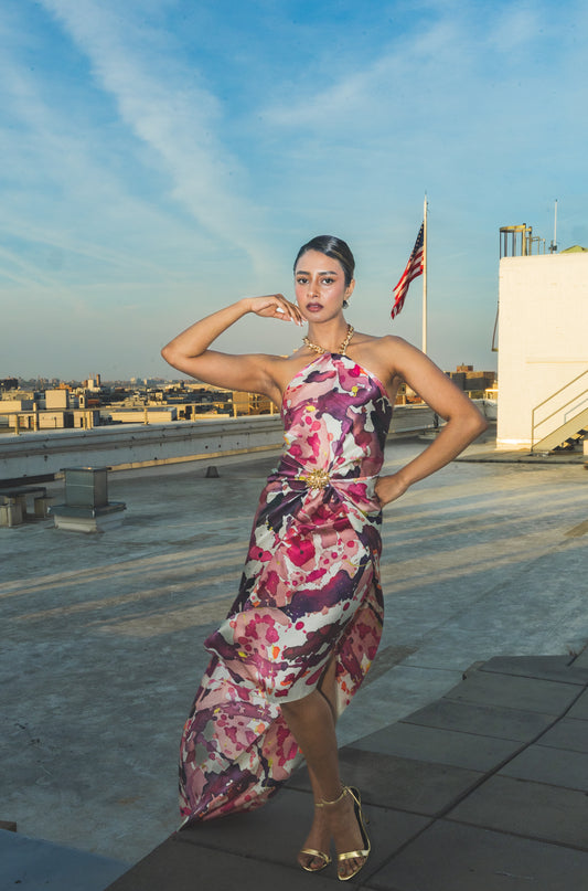 Woman in a floral dress on a rooftop 