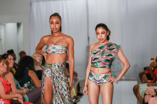 Models wearing Jungla printed swimwear, including shortie bikini bottoms, on a runway.