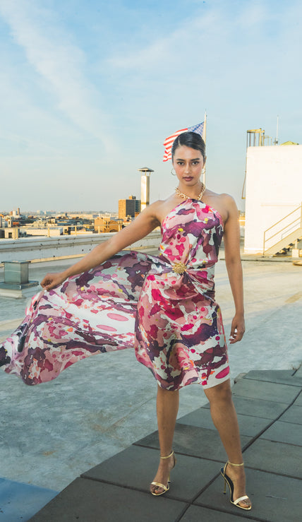 Luxury silk scarf styled as an elegant floral dress on a rooftop fashion shoot