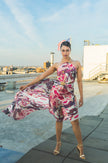 Luxury silk scarf styled as an elegant floral dress on a rooftop fashion shoot