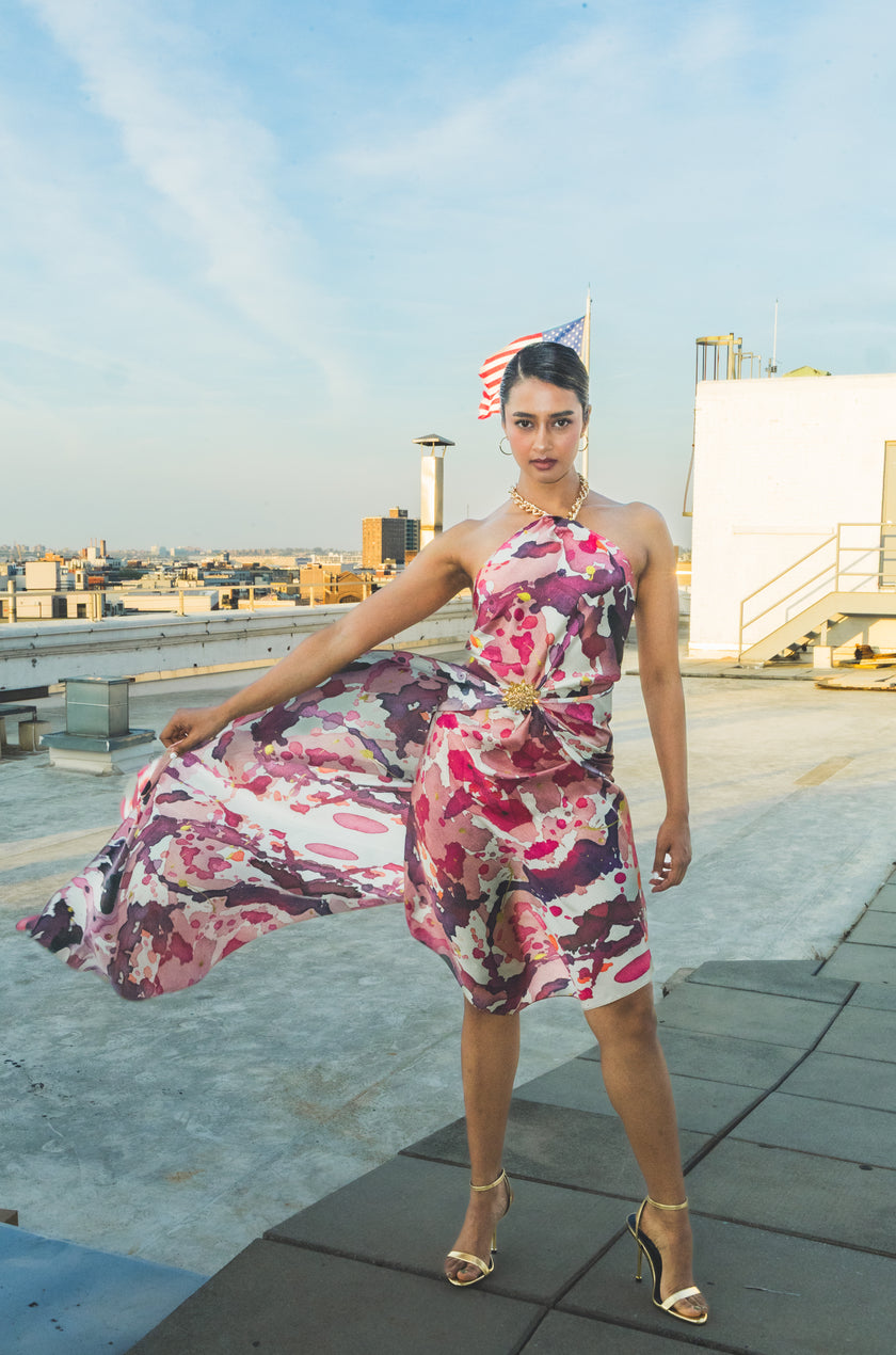 Luxury silk scarf styled as an elegant floral dress on a rooftop fashion shoot