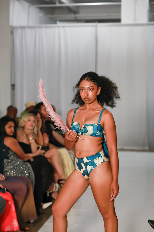 Front view of Ocean waist cinch bikini bottoms featuring a blue, teal and cream print.