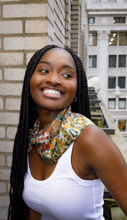 Colorful silk scarf worn by woman on rooftop – Cierramonet fashion style